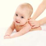 Cute baby massage back child and health concept